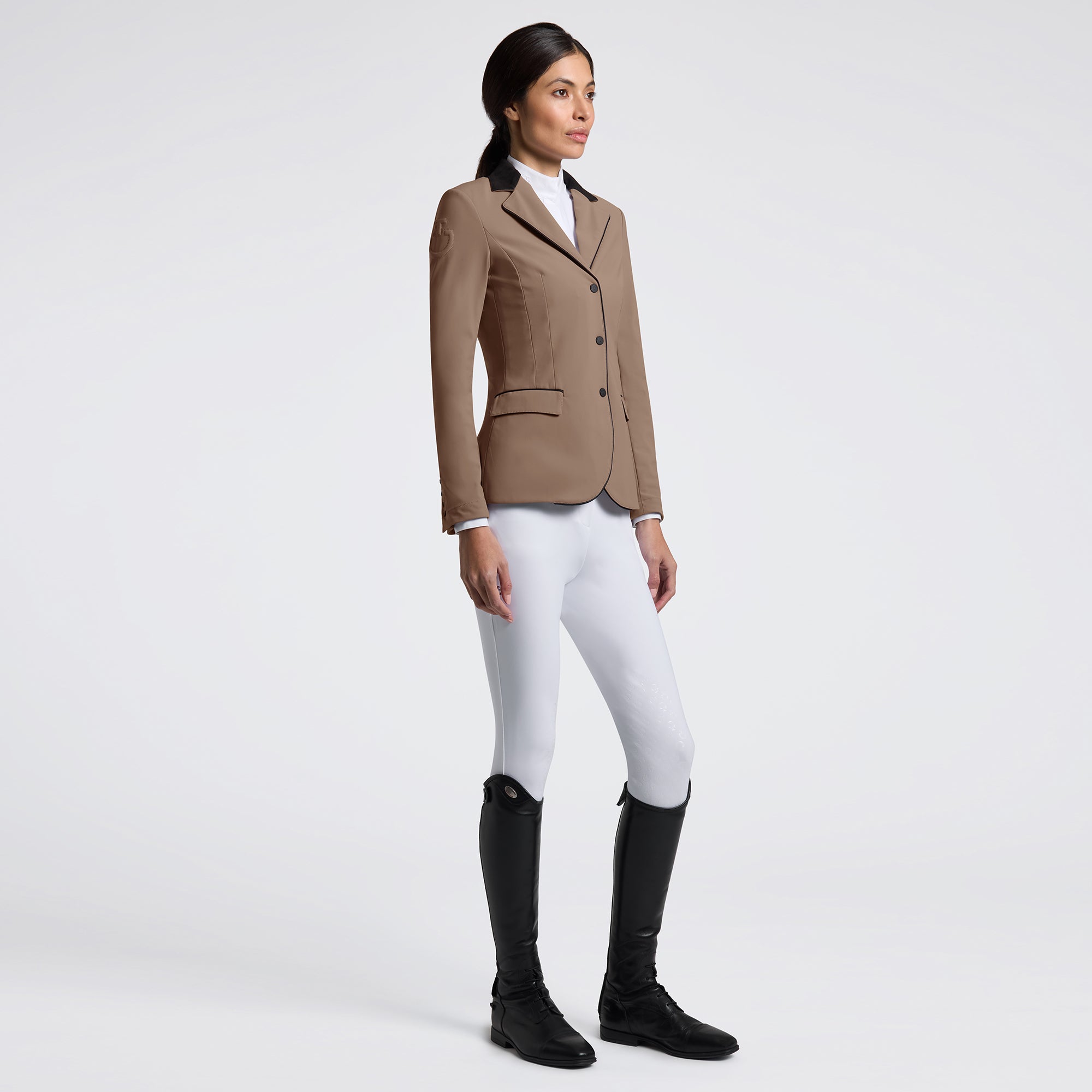 Elevate your riding experience with the Cavalleria Toscana GP Riding Jacket. Designed for both style and performance, this jacket offers a sleek fit that moves with you, ensuring comfort during every ride. Crafted from high-quality materials, it provides breathability and durability, making it ideal for competitive and casual equestrians alike. Embrace elegance and functionality in one essential piece of riding apparel.
