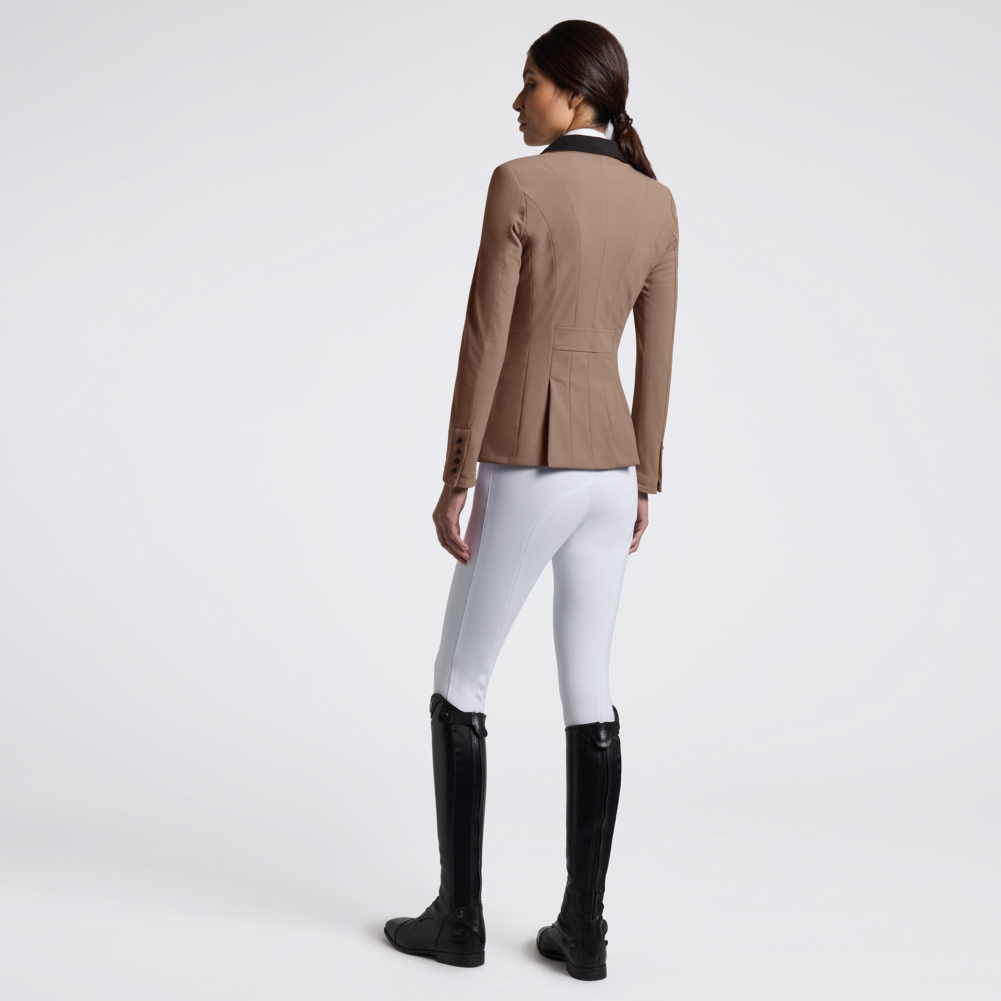 Elevate your riding experience with the Cavalleria Toscana GP Riding Jacket. Designed for both style and performance, this jacket offers a sleek fit that moves with you, ensuring comfort during every ride. Crafted from high-quality materials, it provides breathability and durability, making it ideal for competitive and casual equestrians alike. Embrace elegance and functionality in one essential piece of riding apparel.