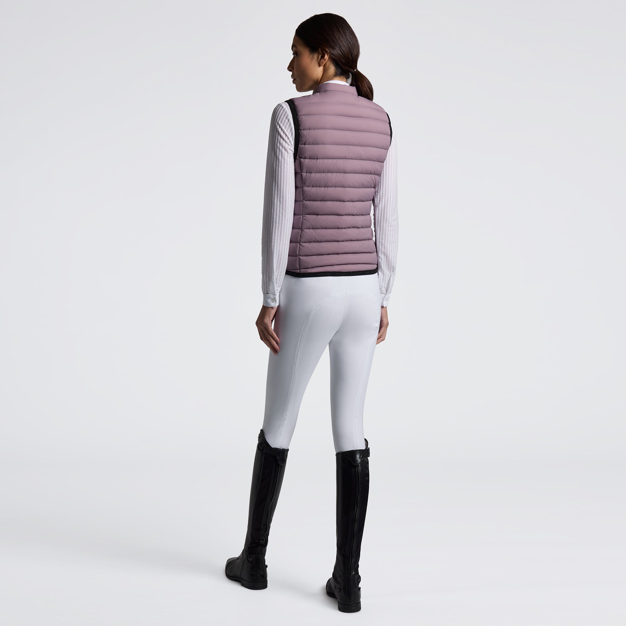 Experience unmatched comfort and style with the Cavalleria Toscana Lightweight Vest. Designed for breathability and ease of movement, this vest is perfect for layering during training or casual outings. Its sleek design ensures you stay both warm and fashionable without feeling weighed down. Elevate your equestrian wardrobe with this versatile, lightweight essential.