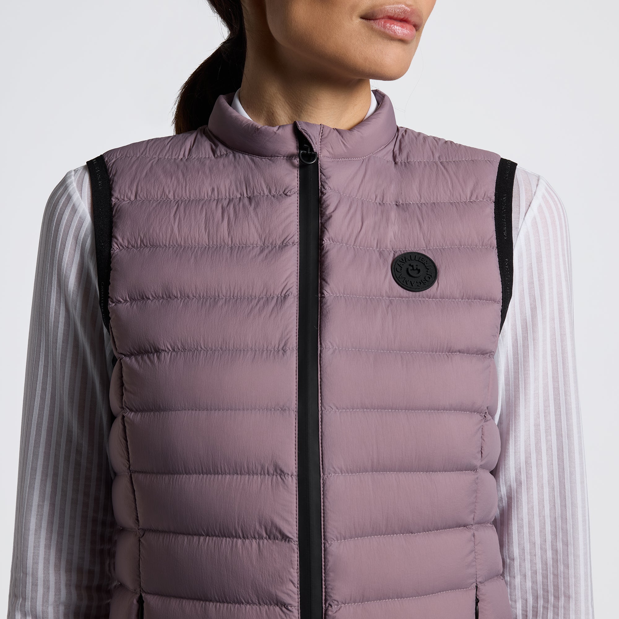 Experience unmatched comfort and style with the Cavalleria Toscana Lightweight Vest. Designed for breathability and ease of movement, this vest is perfect for layering during training or casual outings. Its sleek design ensures you stay both warm and fashionable without feeling weighed down. Elevate your equestrian wardrobe with this versatile, lightweight essential.