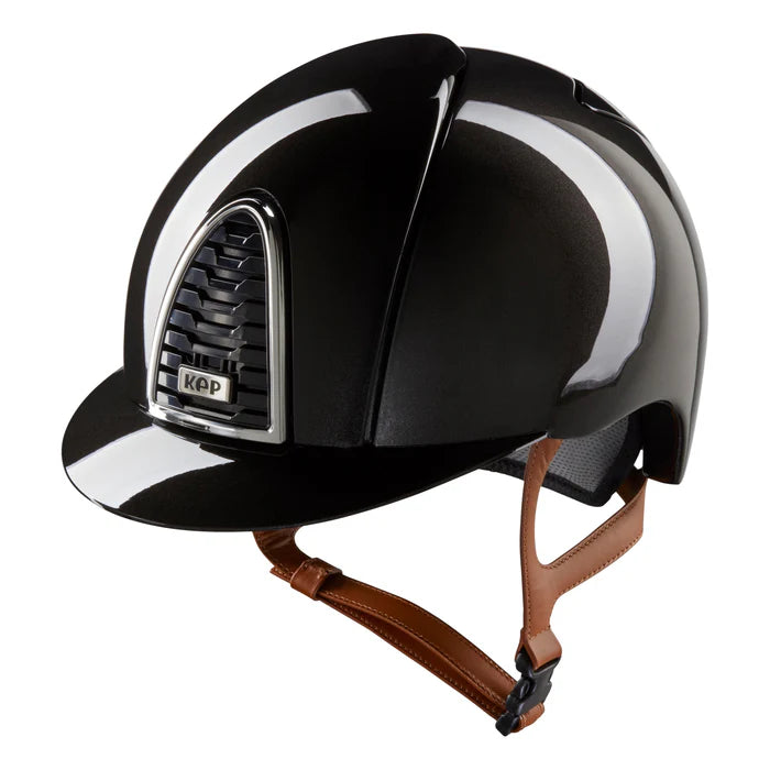 Elevate your riding experience with our Kep Cromo 2.0 Shine Black Riding Hat! This stylish hat features a sleek black design with a stunning beige strap. Made with Cromo 2.0 technology, this hat offers exceptional comfort and protection. Conquer the ring in style and confidence with our Kep Cromo 2.0 Shine Black Riding Hat.