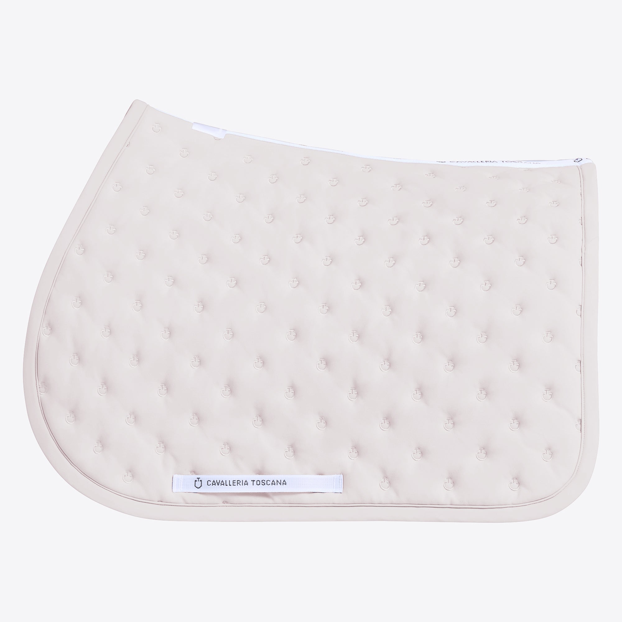 A light beige quilted equestrian saddle pad with a tufted texture and a white brand label reading &
