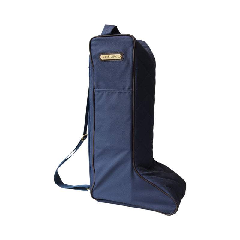 The Kentucky Horsewear Boot Bag offers protection to your riding boots during transportation, at shows and also at home. The Bag is lined with luxurious artificial faux fur on the inside to avoid scratches on the soft leather of your riding boots. The tag features a Kentucky name tag on the front can be turned over and personalized. The bag had two handles on the top and a nylon carry to strap that can be adjusted to make it easy to carry.