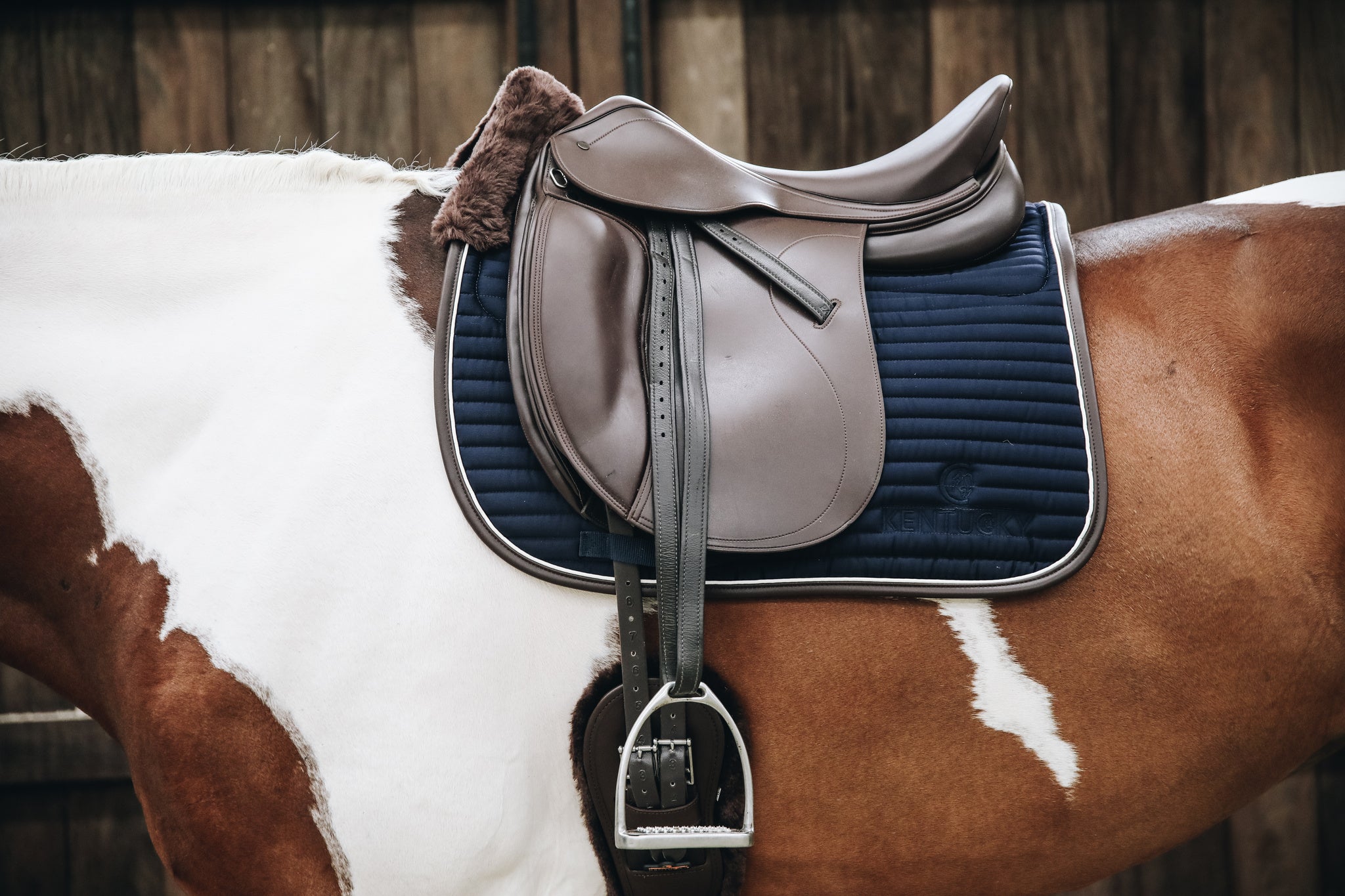 The Kentucky Horsewear Skin Friendly Dressage Pad offers extreme cushioning and support between the horses back and the saddle whilst preventing friction.