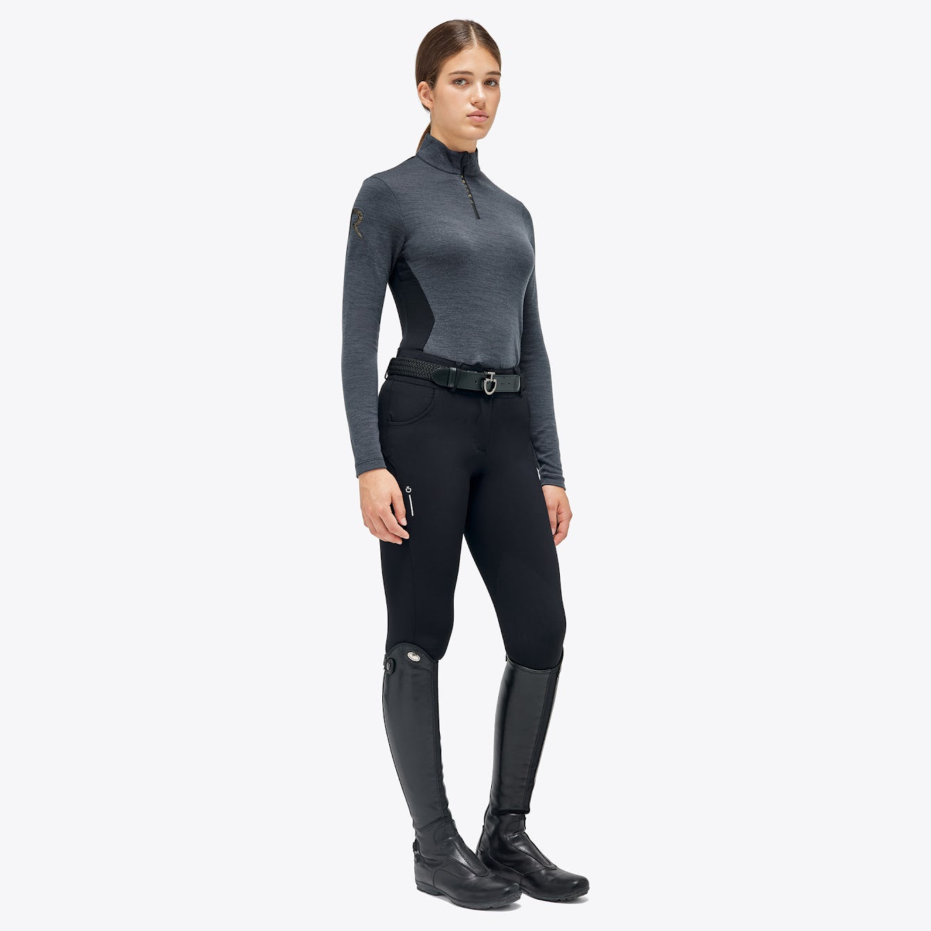 The Cavalleria Toscana Grey and black Revolution Premier Tech Wool training top. The slimming silhouette is feminine yet sporty. Black fine tech knit back gives maximum freedom of movement. This CT training top is perfect for the shows, training or on the yard.