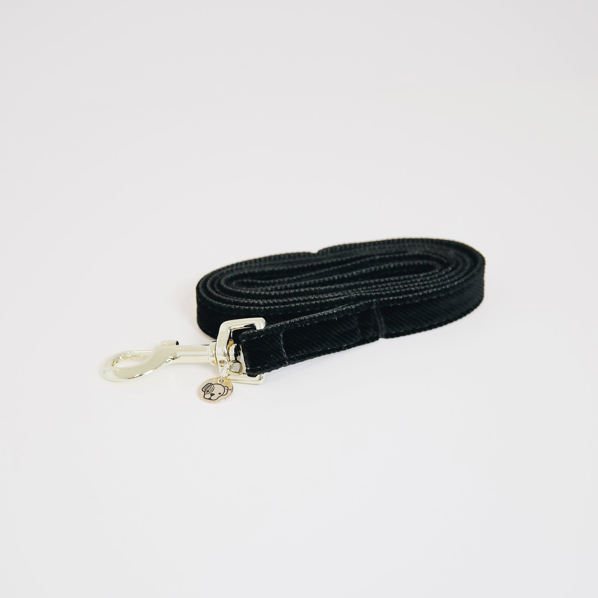 The Kentucky Corduroy lead. Give your dog the luxury it deserves. The lead is made from a super soft baby cord and lined with nylon for extra strength and durability. The lead features the gold Kentucky logo clasp and gold dog tag to engrave your details.
