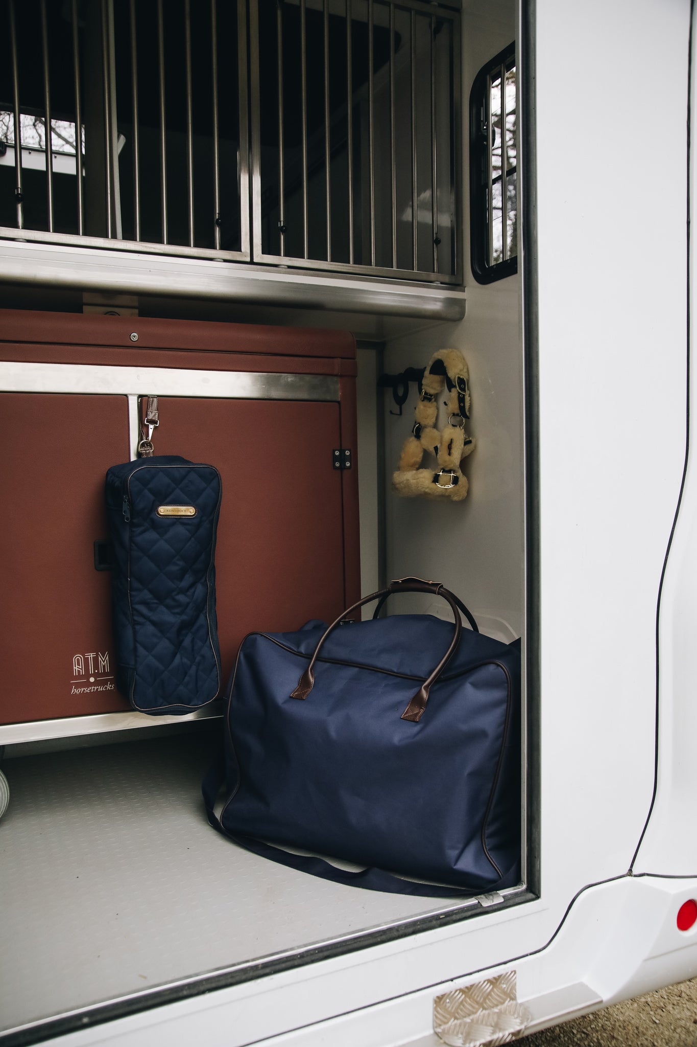 The Kentucky Horsewear Bridle Bag offers protection to your bridles during transportation, at shows or at home. The Bridle Bag has artificial rabbit skin on the inside to avoid scratches on the leather. It features a hook on the inside to easily attach your bridle. The name tag on the front can be turned over to be personalized.