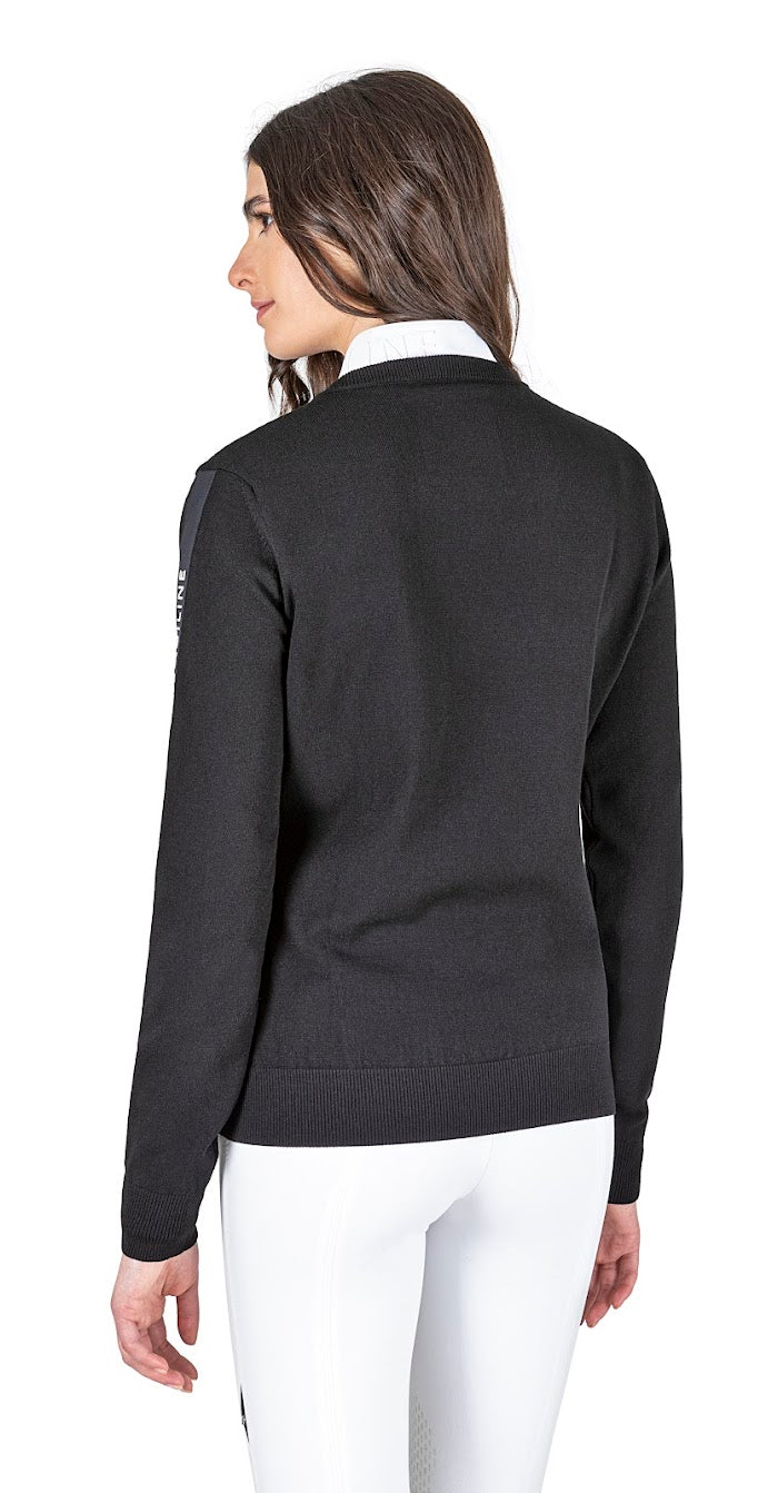 The Equiline Cinoc Black V Neck jumper is great for the shows or the yard. The jumper has a luxury feel and a flattering fit. The Equiline Matt satin line with raised white Equiline logo gives this jumper a modern twist. Matching items available 70% Viscose, 30% polyester Machine Washable