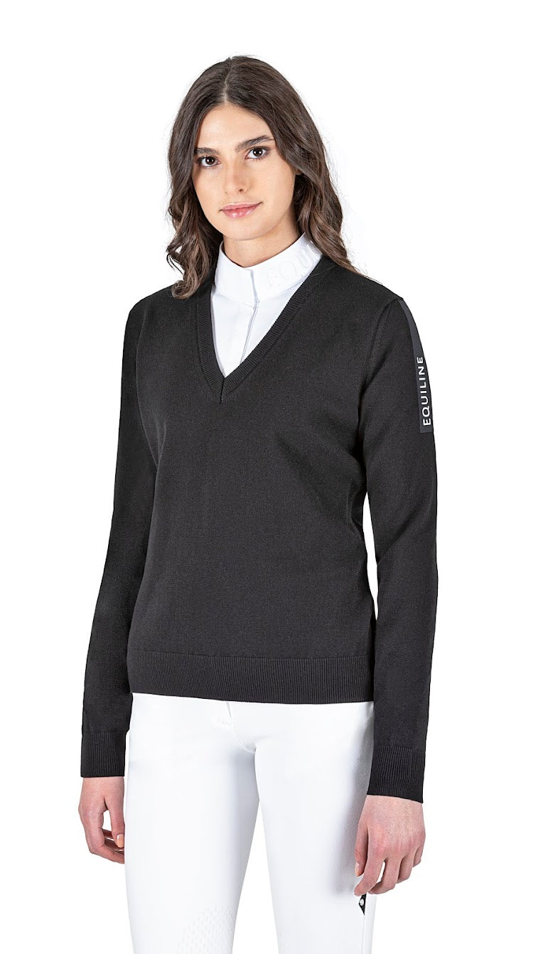 The Equiline Cinoc Black V Neck jumper is great for the shows or the yard. The jumper has a luxury feel and a flattering fit. The Equiline Matt satin line with raised white Equiline logo gives this jumper a modern twist. Matching items available 70% Viscose, 30% polyester Machine Washable