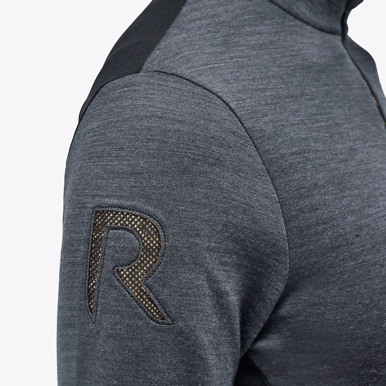 The Cavalleria Toscana Grey and black Revolution Premier Tech Wool training top. The slimming silhouette is feminine yet sporty. Black fine tech knit back gives maximum freedom of movement. This CT training top is perfect for the shows, training or on the yard.