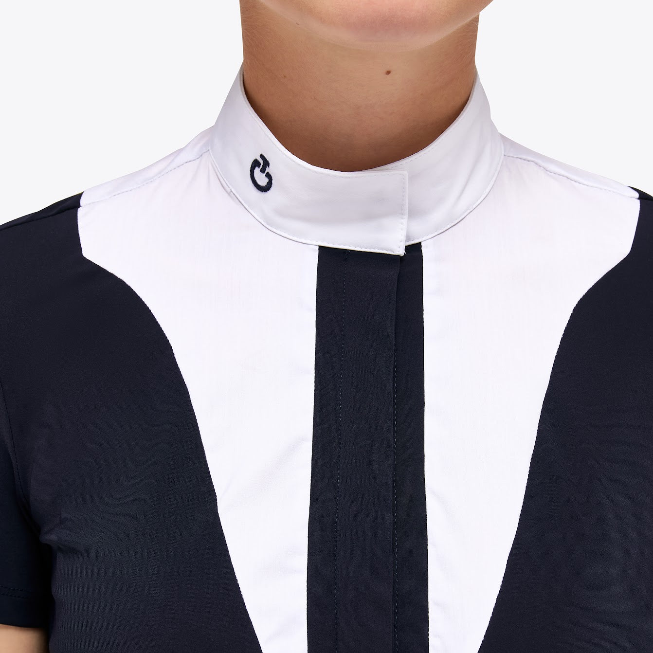 This navy and white S/S Cavalleria Toscana is a great twist on the classic white bib. The scalloped shape front gives a flattering line across the chest with the contrast jersey front placket. Also available in long Sleeve. machine washable