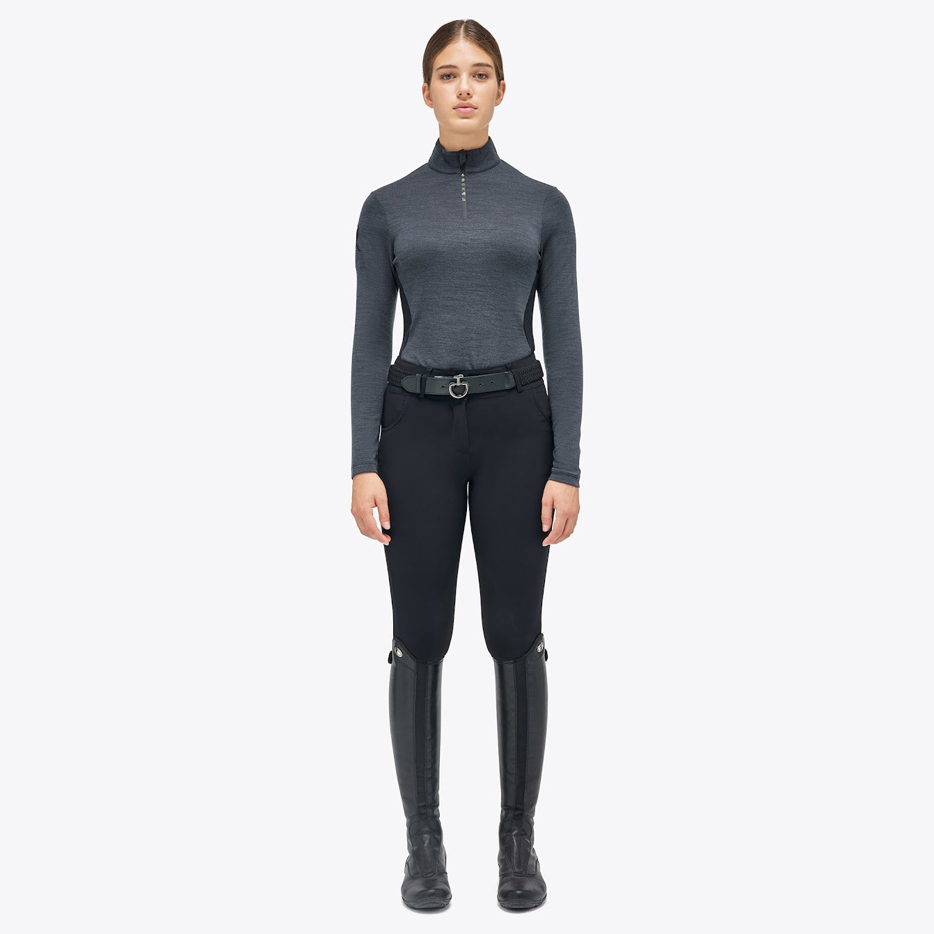 The Cavalleria Toscana Grey and black Revolution Premier Tech Wool training top. The slimming silhouette is feminine yet sporty. Black fine tech knit back gives maximum freedom of movement. This CT training top is perfect for the shows, training or on the yard.