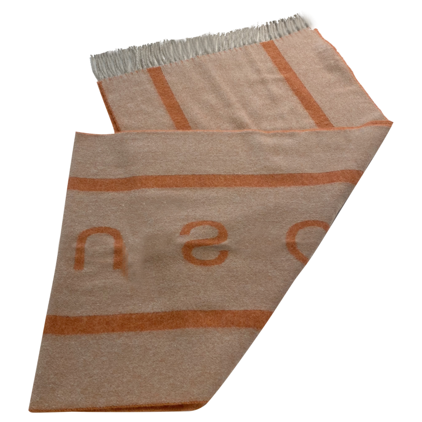 Laguso Signature orange scarf is the perfect accompaniment this season. The scarf is oversized and has a reversable design to give you maximum style options. Machine washable at 30’c