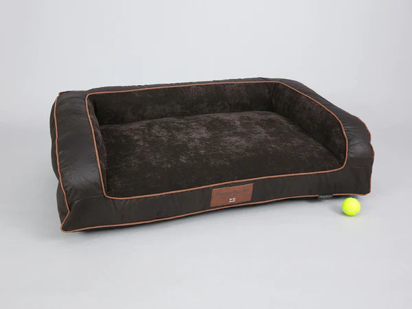 The George Barclay Monxton, sofa bed, has been produced using the finest quality upholstery fabric. A soft woven fabric covers the centre pillow and inner sidewalls, this is paired with contrasting faux leather exterior. The bed is finished with faux suede piping, with an embossed faux leather centre patch, which includes an English flag emblem to complete the beds signature styling.