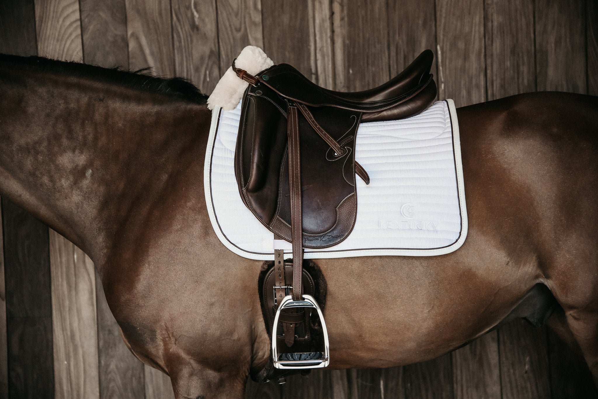 The Kentucky Horsewear Skin Friendly Dressage Pad offers extreme cushioning and support between the horses back and the saddle whilst preventing friction.