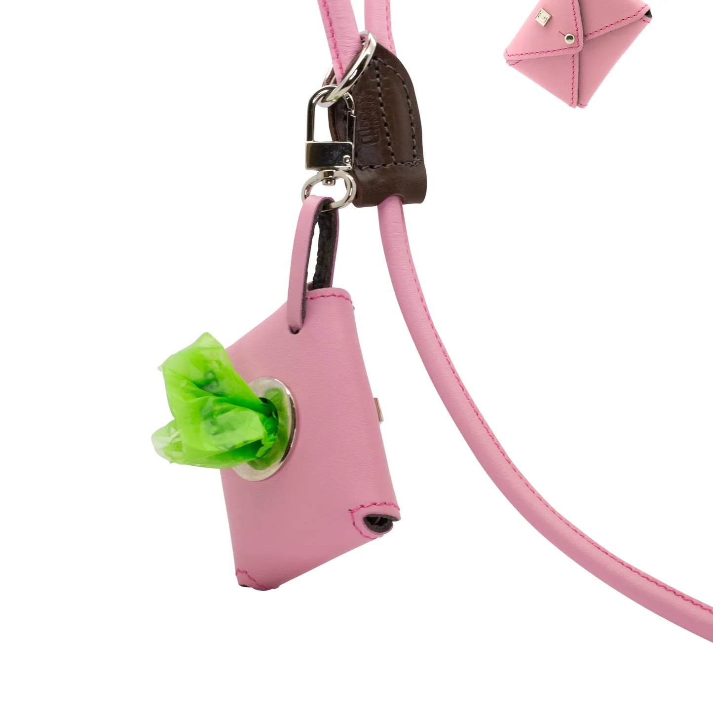 Dogs and horses Poosh leather poo-bag dispenser available in our House and Traditional colours as well as Spring-Summer and Autumn-Winter shades. Features a strong clip to attach to the O-ring in your dog lead (or anywhere else). Accommodates one standard size poo-bag roll which you can pull free one at a time through the porthole.