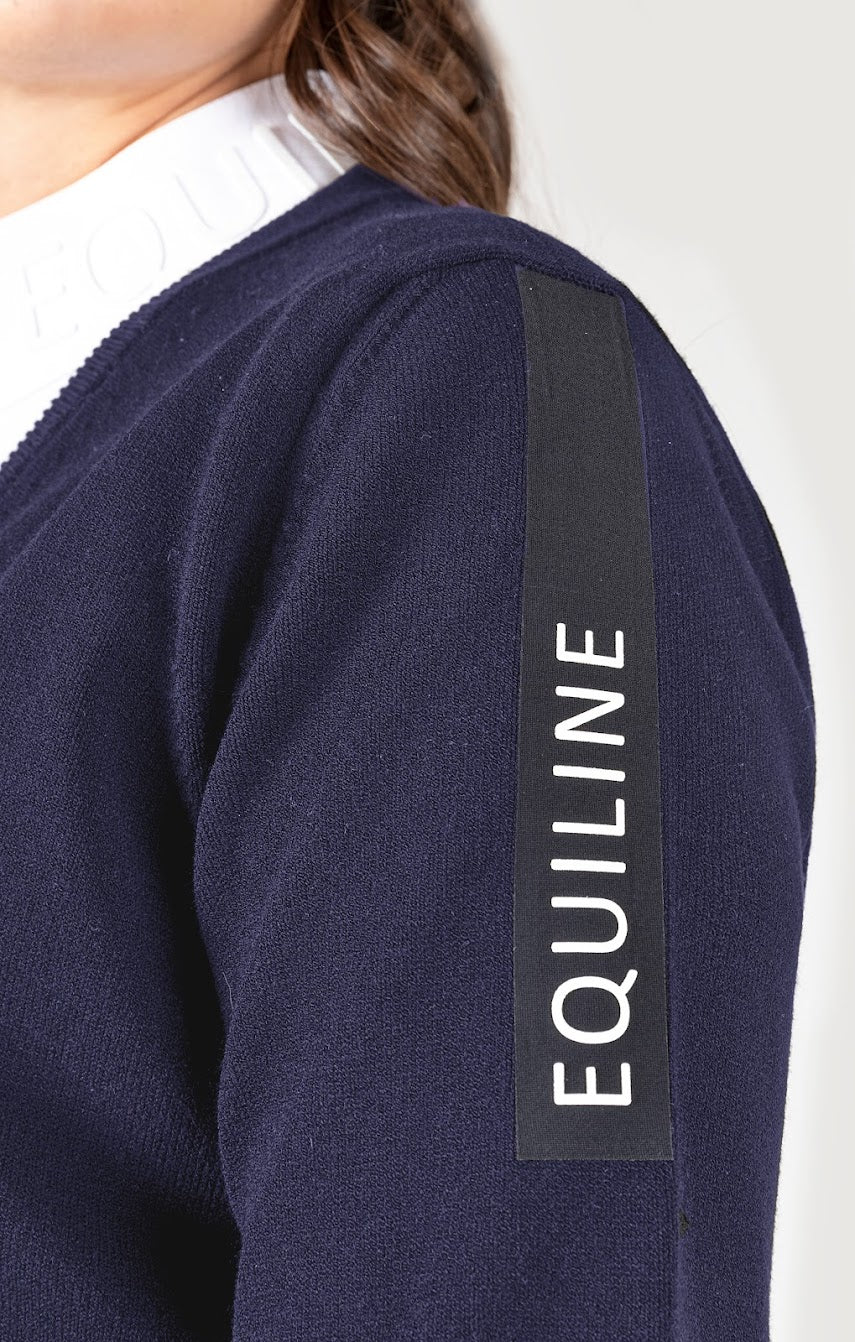 The Equiline Cinoc Pullover is the perfect jumper for training or to complete your competition look. This knitted V neck sweater is is finished with contemporary black table town the sleeve with Equiline written in White. Available in Cobalt Blue or Black.