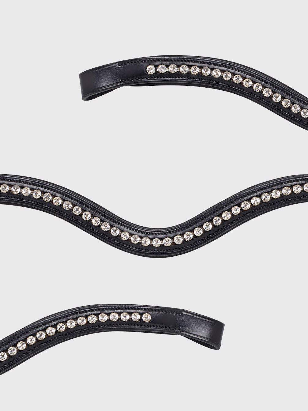 The Equiline U shaped browband embellished with diamantés. These crystals are inset so won’t catch on anything and add the perfect sparkle to your horses bridle. The shape offers movement and optimum comfort for your horse and is made with soft and supple Italian leather.