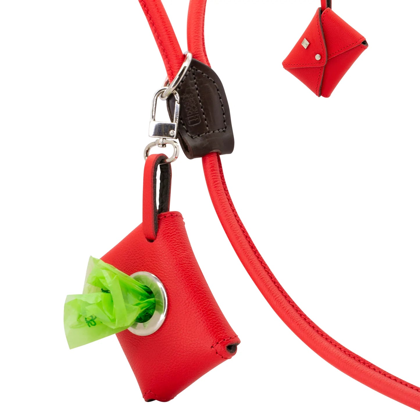 Dogs and horses Poosh leather poo-bag dispenser available in our House and Traditional colours as well as Spring-Summer and Autumn-Winter shades. Features a strong clip to attach to the O-ring in your dog lead (or anywhere else). Accommodates one standard size poo-bag roll which you can pull free one at a time through the porthole.