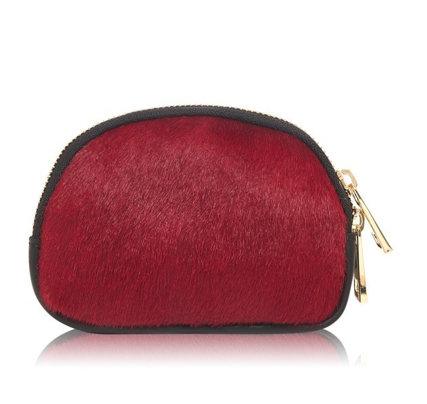 IG Equine Leather and Hide Coin Purse A great little coin purse or handy purse to put in your essentials. Made from super soft black leather back and hide front. Fully lined. The zip opens all the way across for easy access. Matching zippers to our ruck sacks and bags for great coordination. We love this little purse, looks great with the Moda in Pelle trainers or a great little gift. Please note the design maybe different on the pony. They are not all exactly the same.
