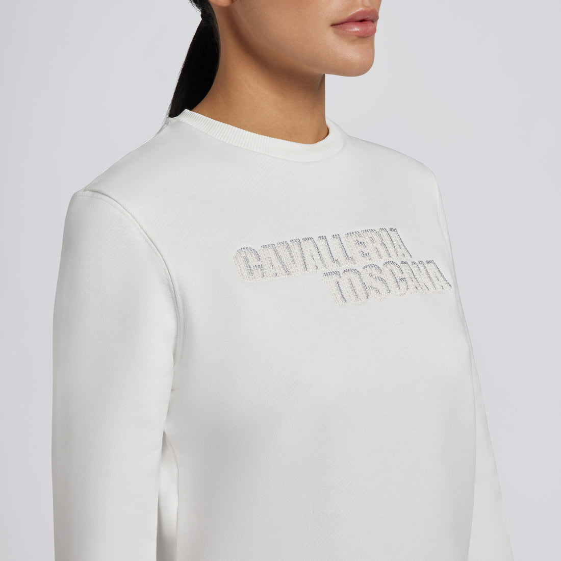 Capture the essence of the Cavalleria Toscana Cotton Crew Neck Sweatshirt with a series of images that highlight its softness, comfort, and style. Use close-up shots to showcase the quality cotton fabric and Cavalleria Toscana branding. Include lifestyle images of the sweatshirt being worn in both equestrian and casual settings, demonstrating its versatility and classic appeal.