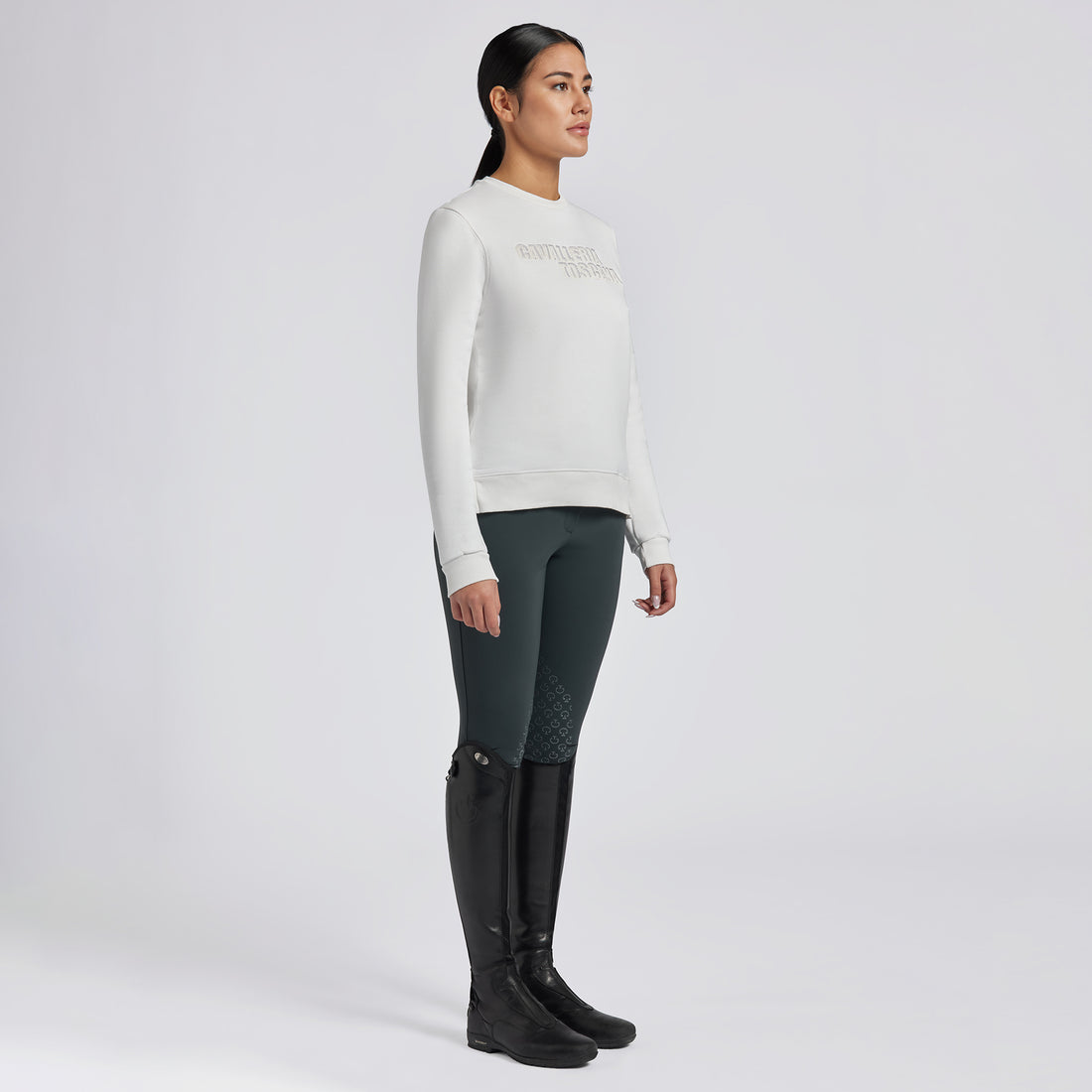 Capture the essence of the Cavalleria Toscana Cotton Crew Neck Sweatshirt with a series of images that highlight its softness, comfort, and style. Use close-up shots to showcase the quality cotton fabric and Cavalleria Toscana branding. Include lifestyle images of the sweatshirt being worn in both equestrian and casual settings, demonstrating its versatility and classic appeal.