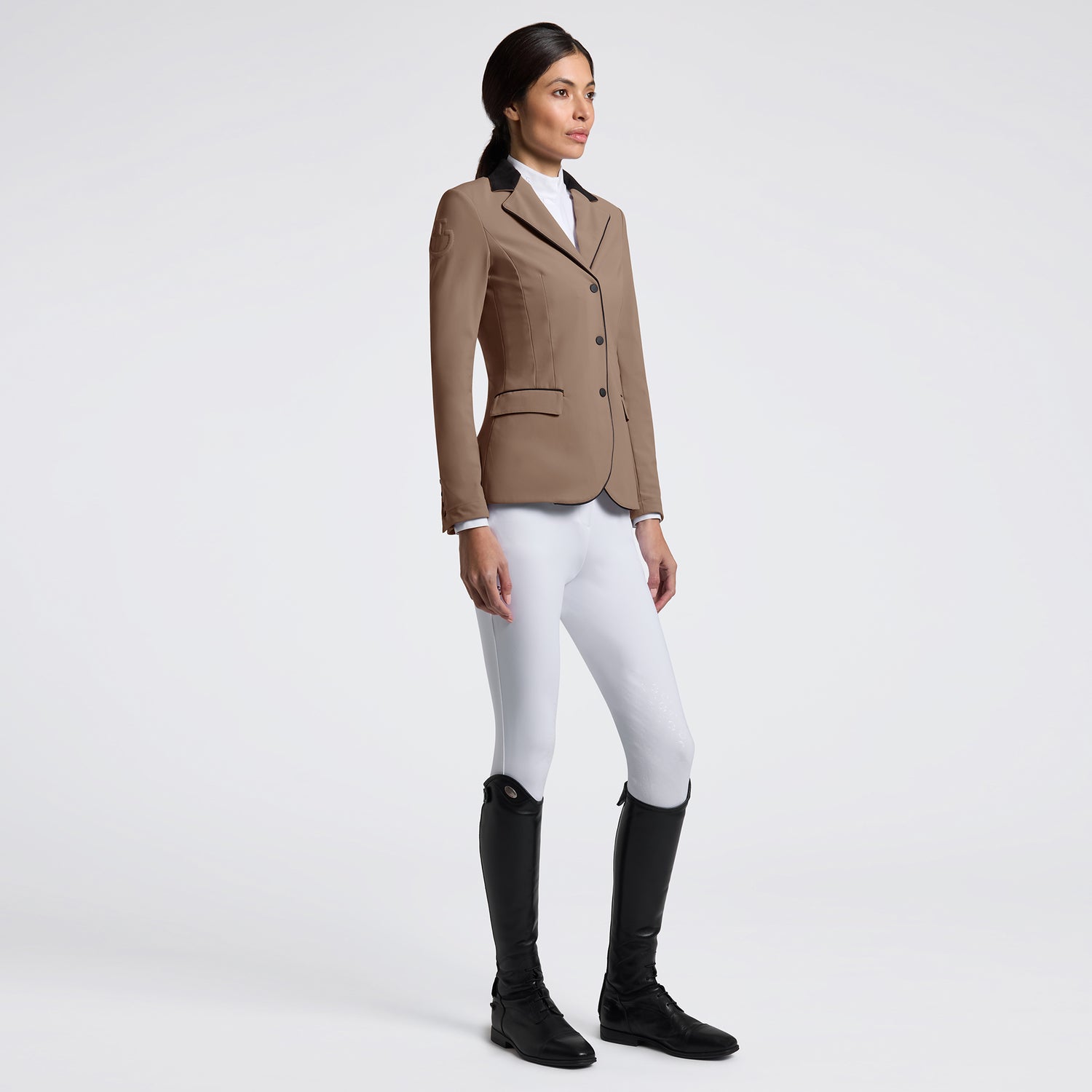 Elevate your riding experience with the Cavalleria Toscana GP Riding Jacket. Designed for both style and performance, this jacket offers a sleek fit that moves with you, ensuring comfort during every ride. Crafted from high-quality materials, it provides breathability and durability, making it ideal for competitive and casual equestrians alike. Embrace elegance and functionality in one essential piece of riding apparel.