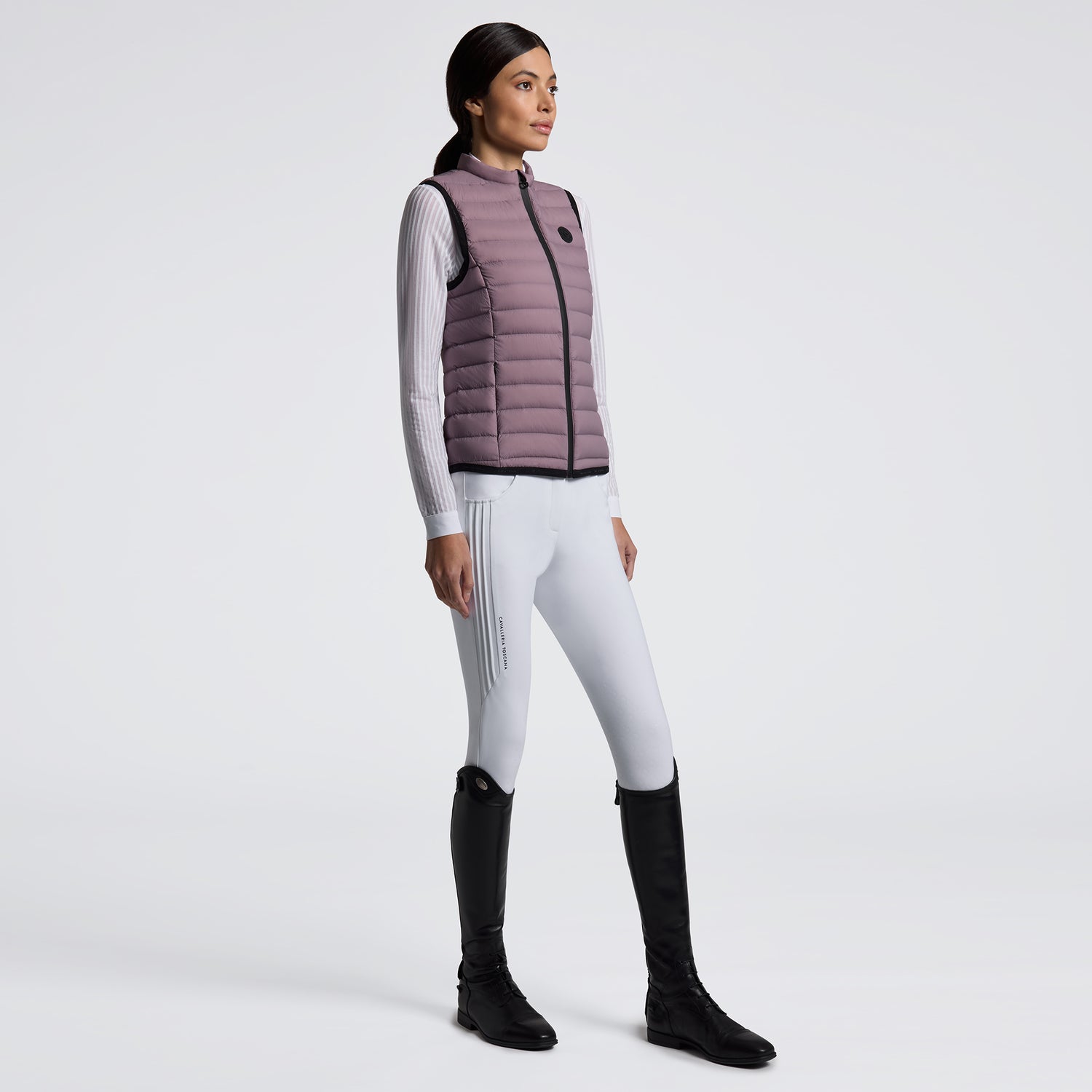 Experience unmatched comfort and style with the Cavalleria Toscana Lightweight Vest. Designed for breathability and ease of movement, this vest is perfect for layering during training or casual outings. Its sleek design ensures you stay both warm and fashionable without feeling weighed down. Elevate your equestrian wardrobe with this versatile, lightweight essential.