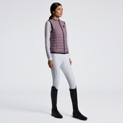 Experience unmatched comfort and style with the Cavalleria Toscana Lightweight Vest. Designed for breathability and ease of movement, this vest is perfect for layering during training or casual outings. Its sleek design ensures you stay both warm and fashionable without feeling weighed down. Elevate your equestrian wardrobe with this versatile, lightweight essential.