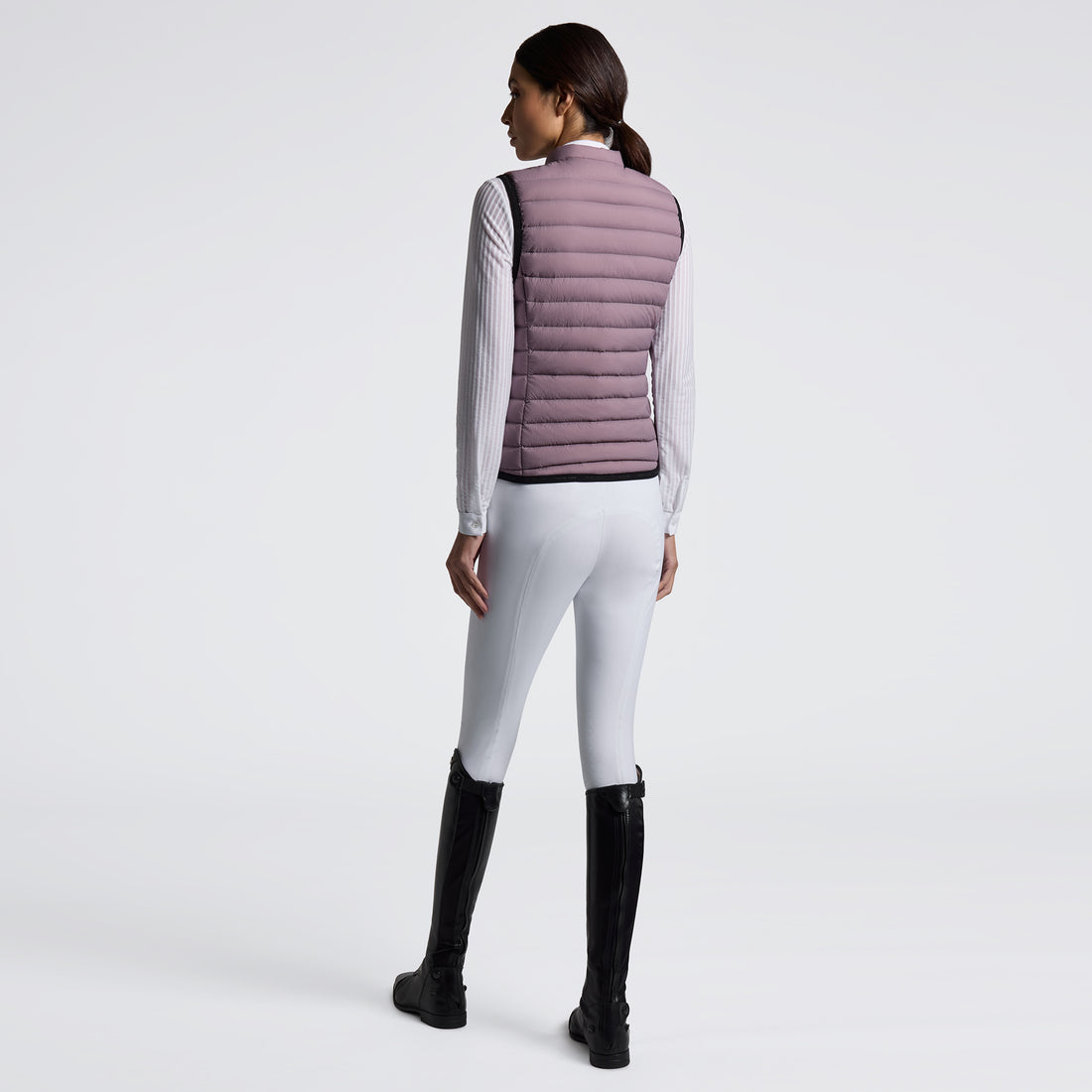 Experience unmatched comfort and style with the Cavalleria Toscana Lightweight Vest. Designed for breathability and ease of movement, this vest is perfect for layering during training or casual outings. Its sleek design ensures you stay both warm and fashionable without feeling weighed down. Elevate your equestrian wardrobe with this versatile, lightweight essential.