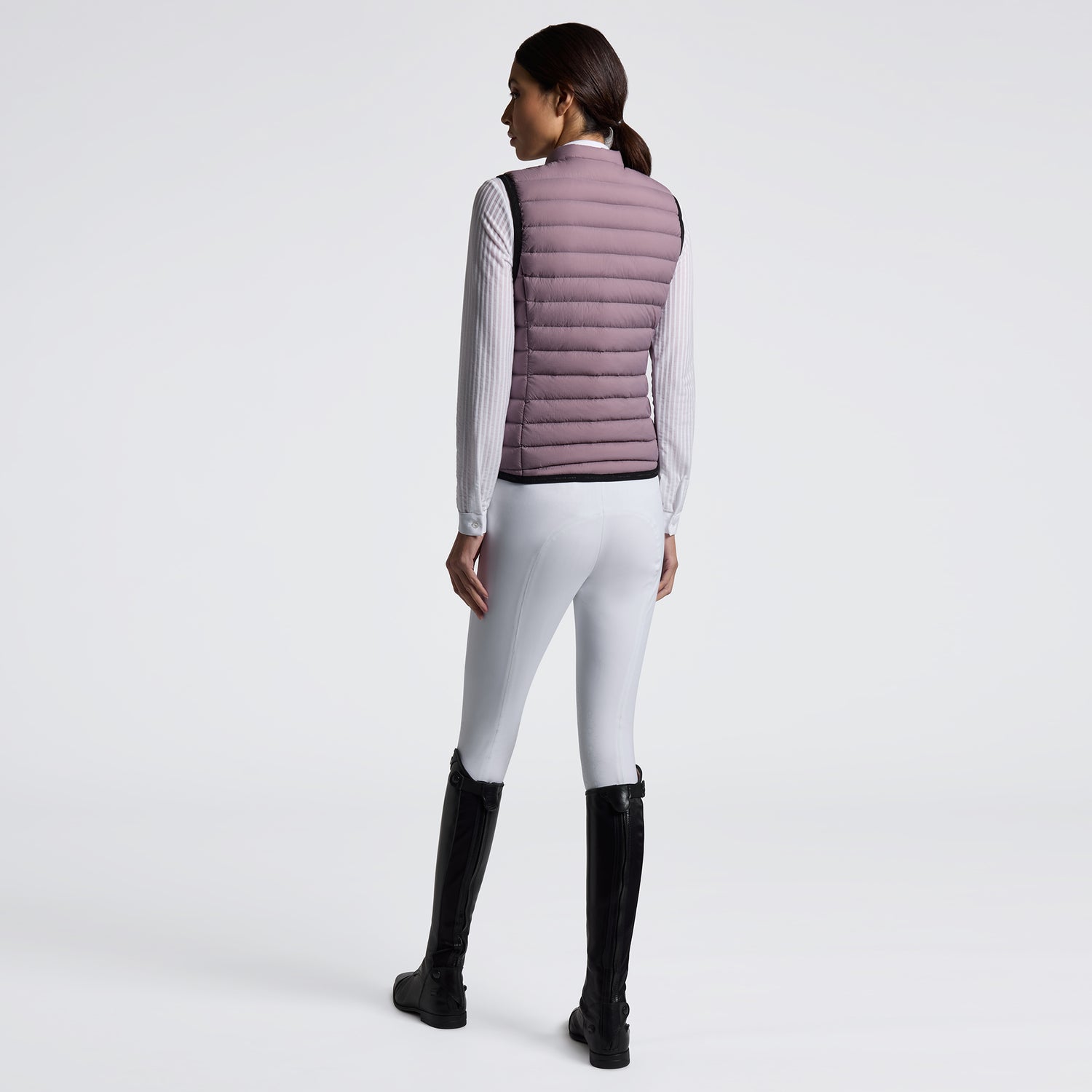 Experience unmatched comfort and style with the Cavalleria Toscana Lightweight Vest. Designed for breathability and ease of movement, this vest is perfect for layering during training or casual outings. Its sleek design ensures you stay both warm and fashionable without feeling weighed down. Elevate your equestrian wardrobe with this versatile, lightweight essential.