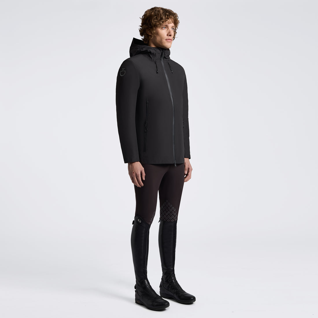 Man in black coat on white background 