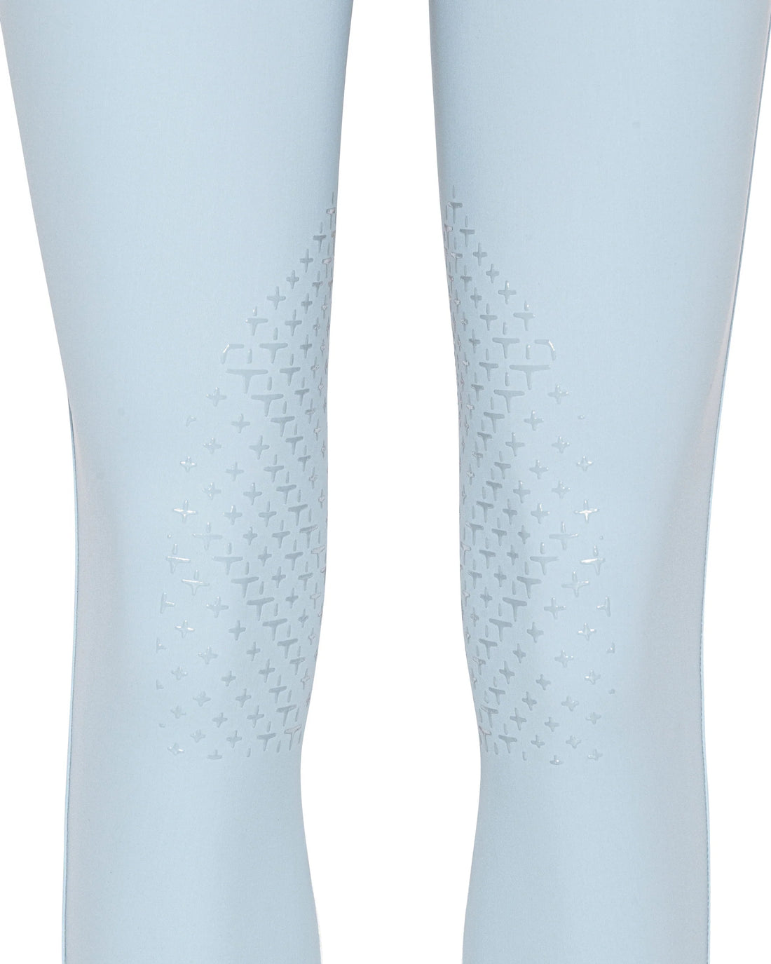 Close-up of a pair of light blue leggings with a subtle geometric pattern on the inner thighs, shown on a white background.