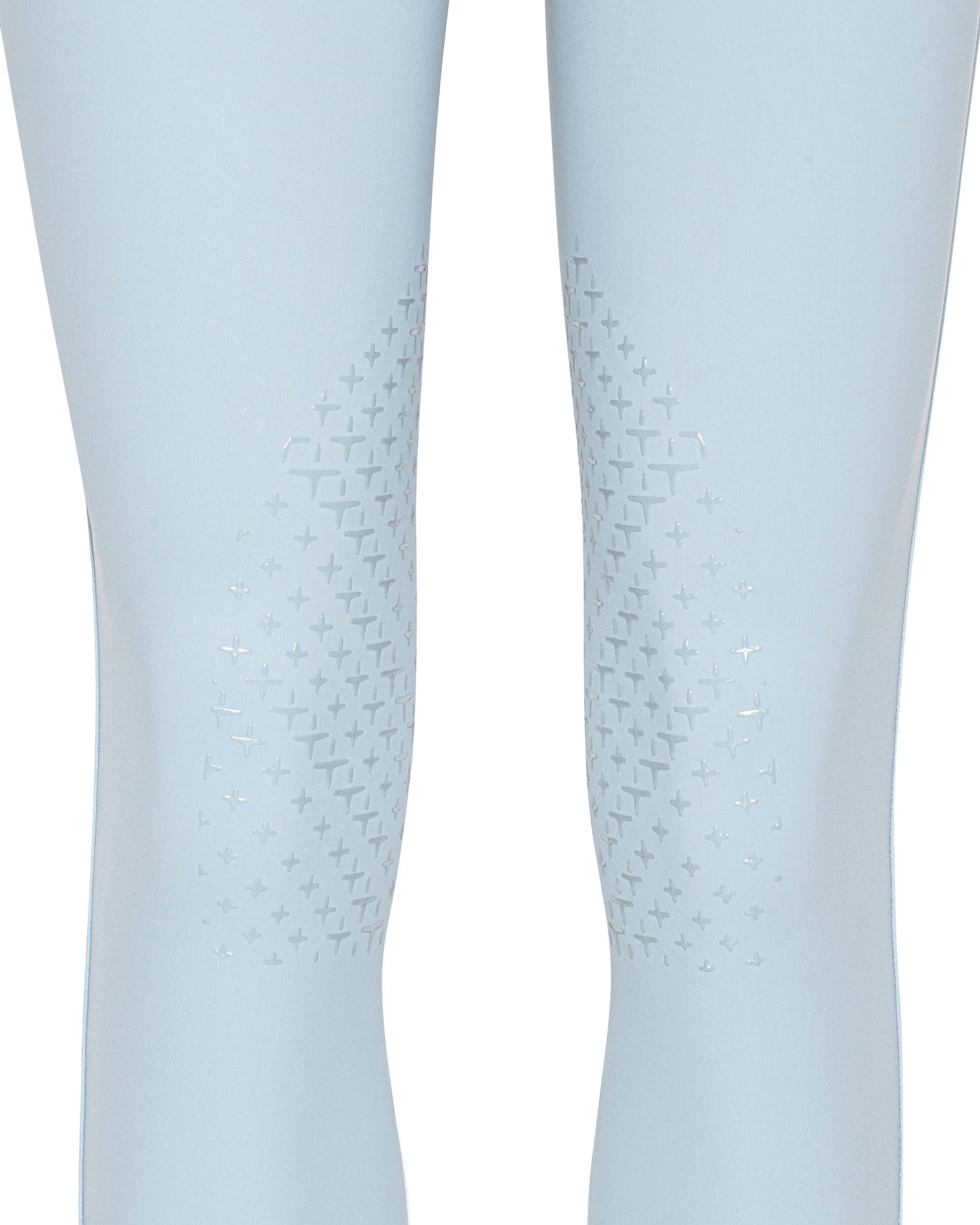 Close-up of a pair of light blue leggings with a subtle geometric pattern on the inner thighs, shown on a white background.