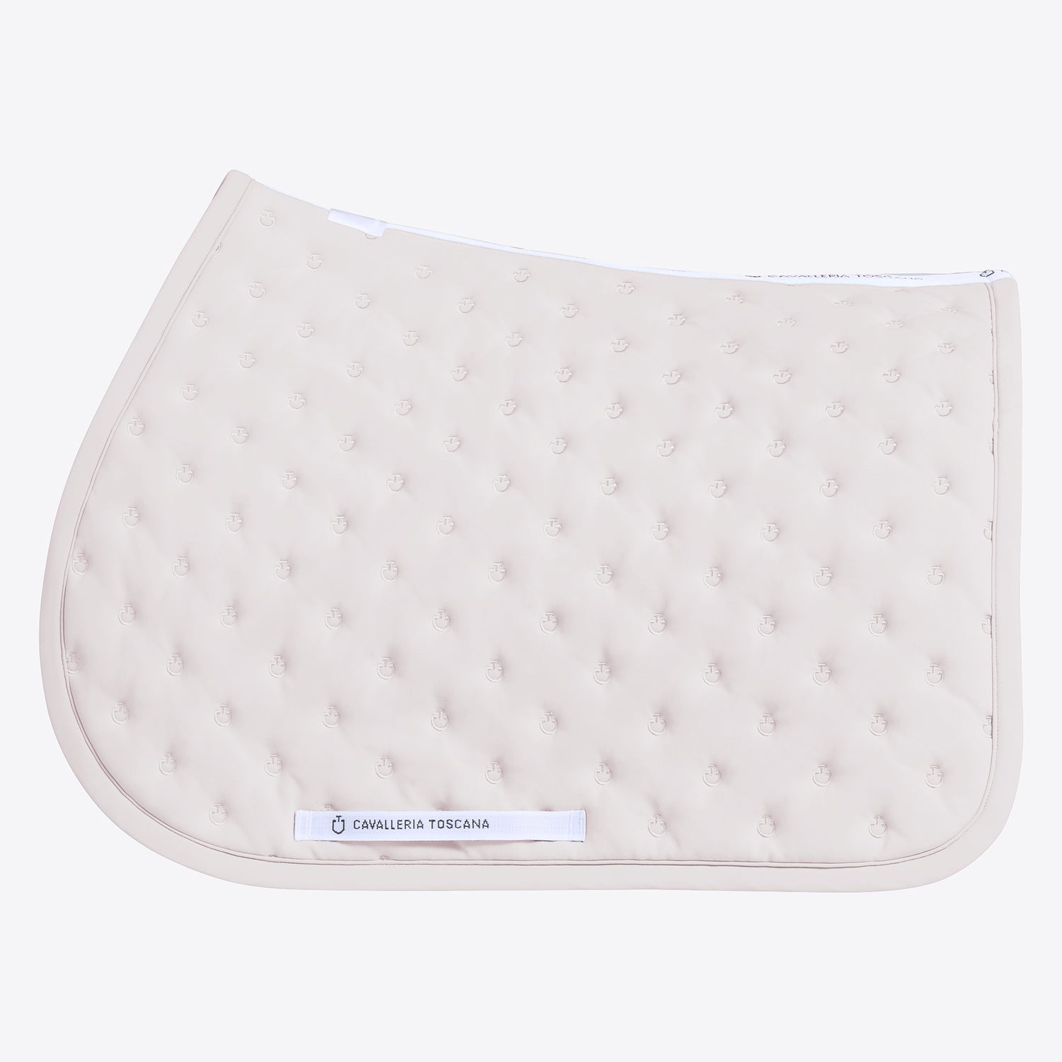 A light beige quilted equestrian saddle pad with a tufted texture and a white brand label reading &