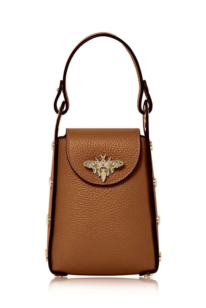 The leather bee bag is an Elegant and Fashionable Small Size Handbag. It has a dual option as a Crossbody Bag or handle, it comes with a Detachable Golden Bag Chain. The bag has Enough Space for Essential Small Items for when your out and about. The bag is Decorated with Bee-shaped Snap that discretely creates the clasp. 