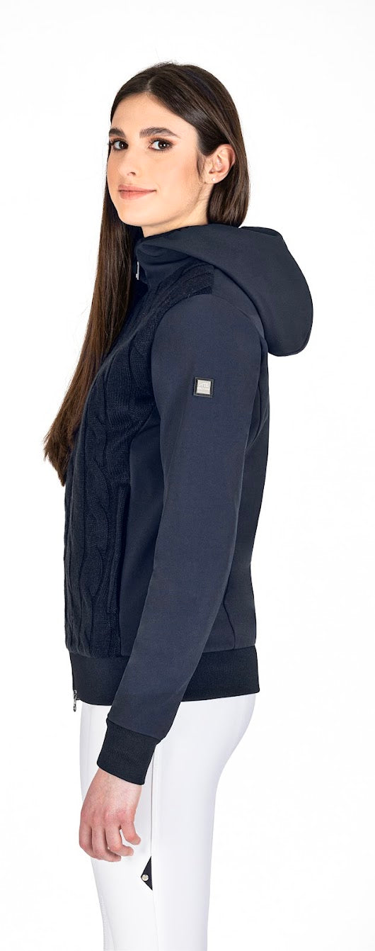 The Equiline Navy Knit Soft Shell Jacket has a luxury fully lined cable knitted front with soft shell back, hood and sleeves.  This jacket has a modern twist to a classic.  perfect for this seasons changing weather. 