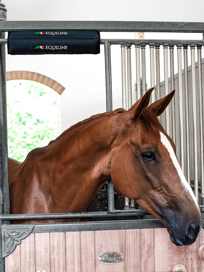 Protect your horse in their stable either at home and away with the Equiline padded head protector.