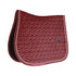 The Saddle Pad Basic Velvet is shaped for jumping and provides excellent cushioning between the horse’s back and the saddle while protecting against friction. It is stylish And classy, with a double twisted piping. This pad has no annoying straps to attach to the saddle, only a nylon strap for the girth. The subtle artificial leather logo is placed in a central,
