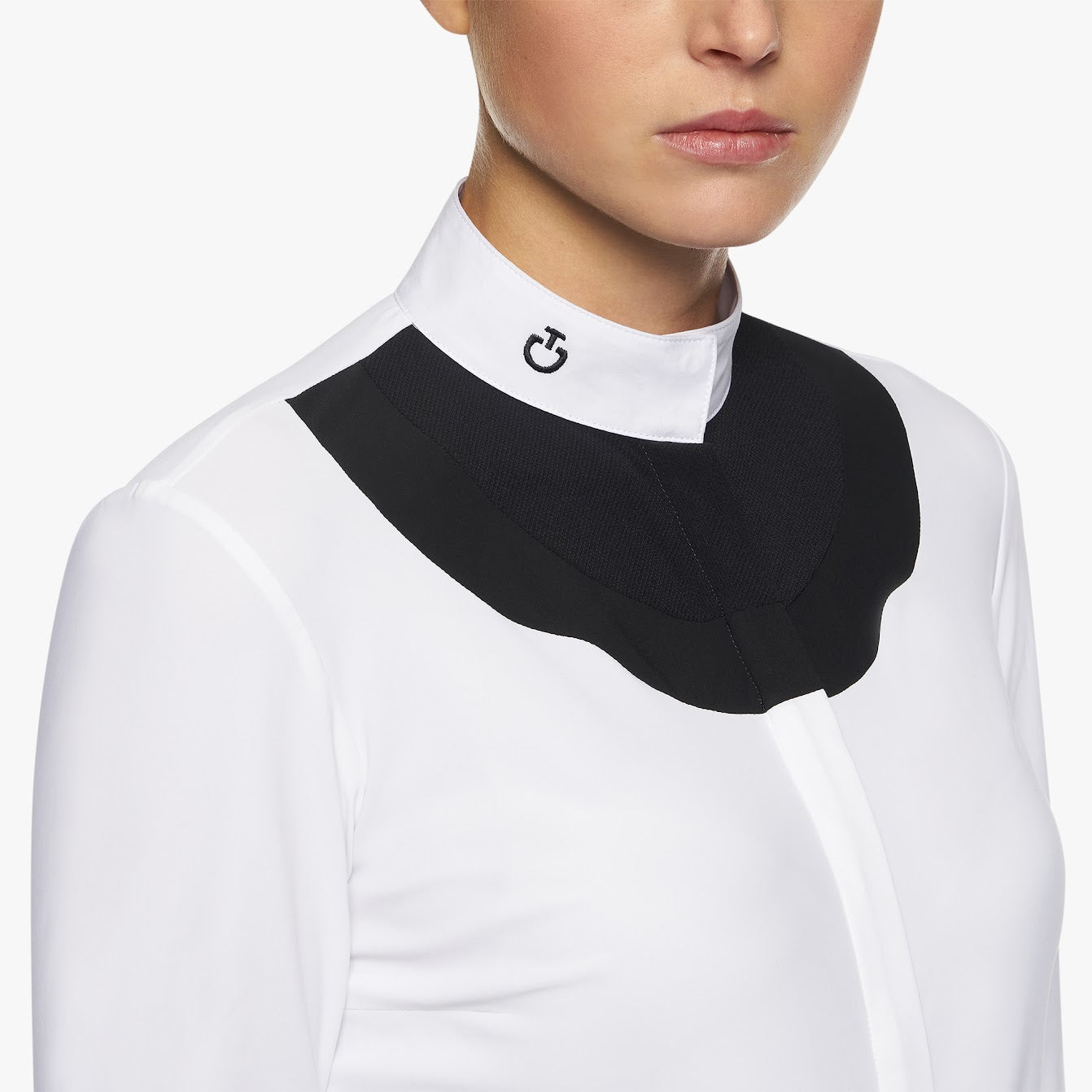 Stand out from the crowd with the stunning Cavalleria Toscana Scalloped long sleeve show shirt. The show shirt features a contrast black scallop design at the chest and cuffs adding a very modern yet sophisticated take on the white shirt. Finished with the iconic embroidered CT logo on the collar .    Machine Washable 