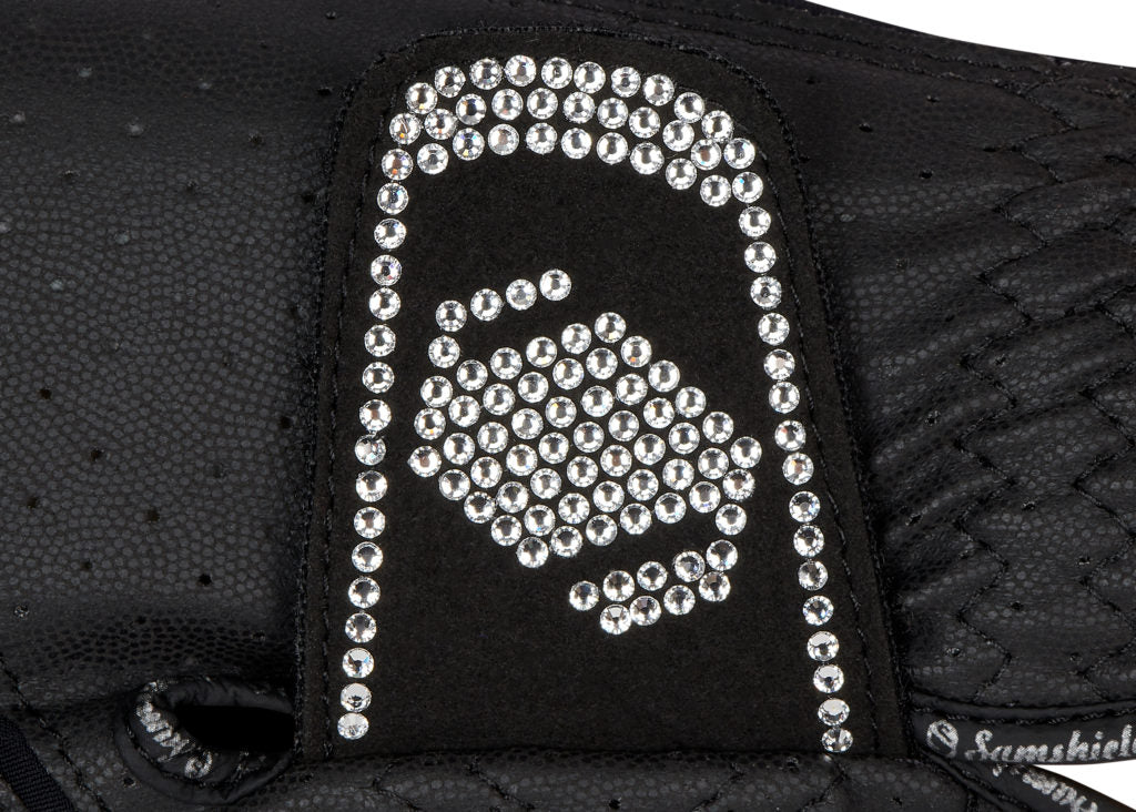 The beautiful Swarovski crystal Samshield Black V skin stretch riding glove to stand out in the crowd. This glove is a highly technical, durable glove. It has a perforated front for comfort and breathability. Textured Silicone grip on the inside. Ergonomically designed for a perfect fit and freedom of movement when riding. Finished with the Samshield logo Embellished with Swarovski Crystals.