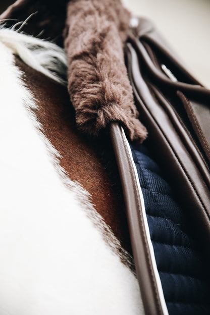 The Kentucky Horsewear Skin Friendly Dressage Pad offers extreme cushioning and support between the horses back and the saddle whilst preventing friction. 