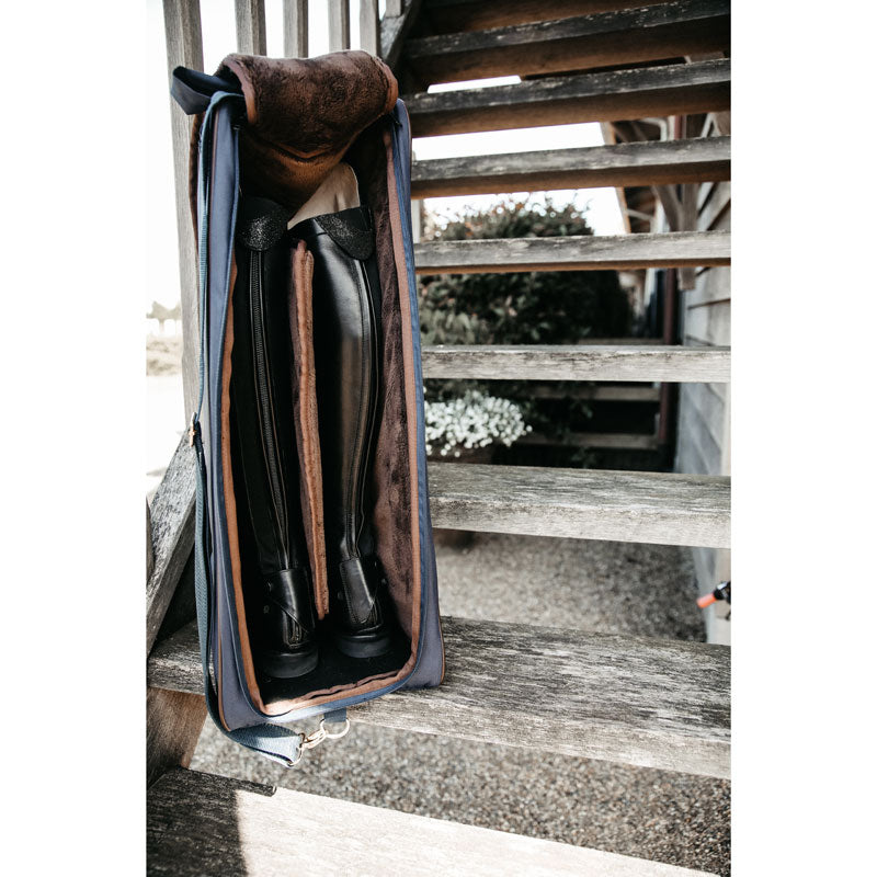 The Kentucky Horsewear Boot Bag offers protection to your riding boots during transportation, at shows and also at home.  The Bag is lined with luxurious artificial faux fur on the inside to avoid scratches on the soft leather of your riding boots.  The tag  features a Kentucky name tag on the front can be turned over and personalized.  The bag had two handles on the top and a nylon carry to strap that can be adjusted to make it easy to carry. 