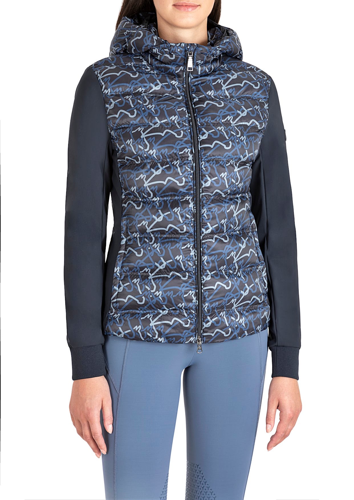 EQUILINE WOMENS PADDED SOFTSHELL JACKET ELRUBE  stand out from the crowd with the great jacket from Equiline. The lightweight yet v warm puffer front with their new horse graphic design  and soft shell sleeves make this a perfect jacket.   Coordinating jumper and breeches available 