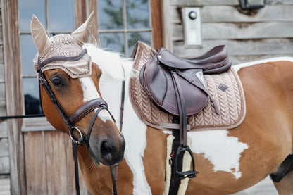The Kentucky velvet and pearls fly veil. Made in the Wellington shape with the square border, these ears are a show stopper. Matching saddle pad available. 
