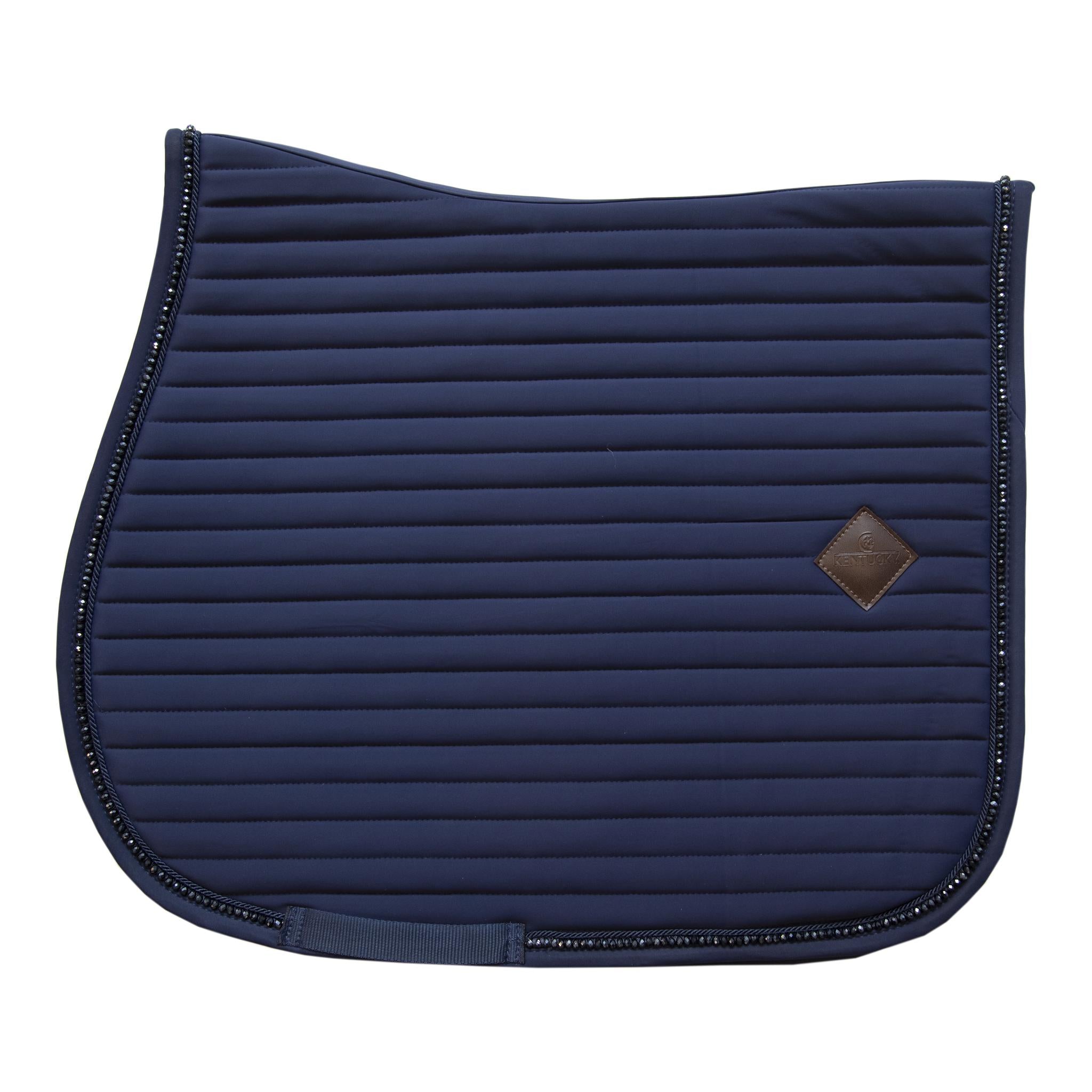 This stunning saddle pad looks great for any occasion. The Kentucky pad has a horizontal design with the Kentucky vegan leather patch. The stunning self coloured crystal give a sophisticated sparkle.   Matching fly vale available. 