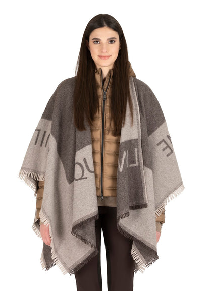 Keep warm and stylish this winter with the new Equiline Poncho. This stunning poncho come in two colour ways grey and camel. Perfect for an extra layer when it gets chilly. Great for the shows or on the slopes. 