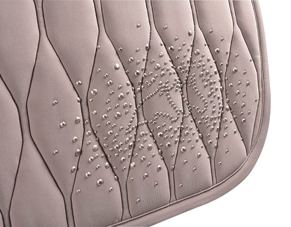 The Equiline jump saddle pad in the shade the shade Sabbia. Beautiful wave quilting and finished with a stunning beading pearl design.