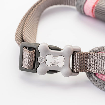 Hugo and Hudson Pink Tweed Harness   The pink dog harnesses are designed to help prevent your dog from pulling, whilst reducing pressure on their neck. The harness is designed so your dog will look and feel great, with four different sizes, that are adjustable , are available to get the perfect fit.  Complete the pink checked set with the lead, collar and checked herringbone tweed jacket.
