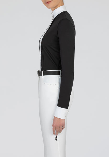 Equiline’s long sleeve show shirt has a twin line of diamanté’s running either side of the button placket gives a stunning look. Jersey fabric with woven placket and cuffs.  Available in black and white and all white. 